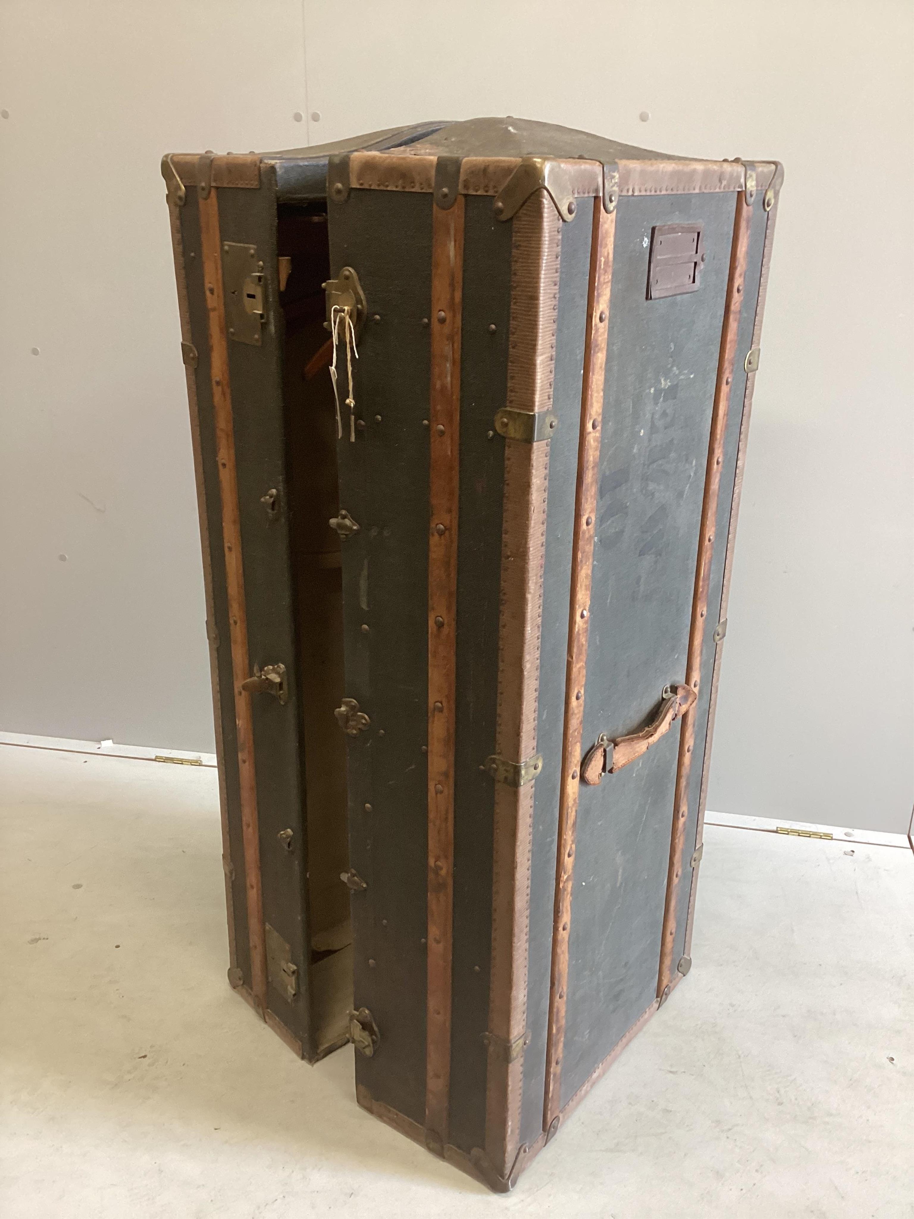 A Victorian wardrobe trunk, width 52cm, depth 55cm, height 130cm